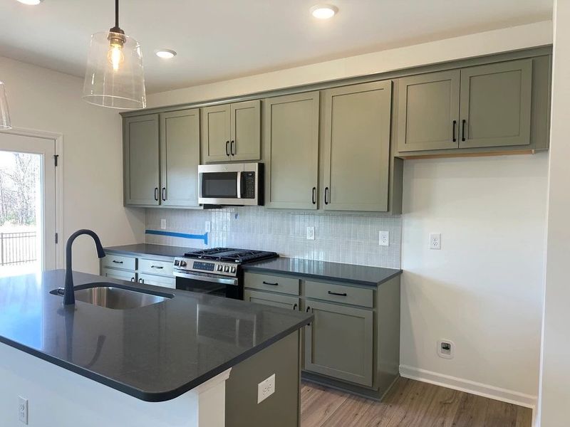 Kitchen featuring the AW Collection® Rosemary - Matte black, light wood, and garden-inspired style.