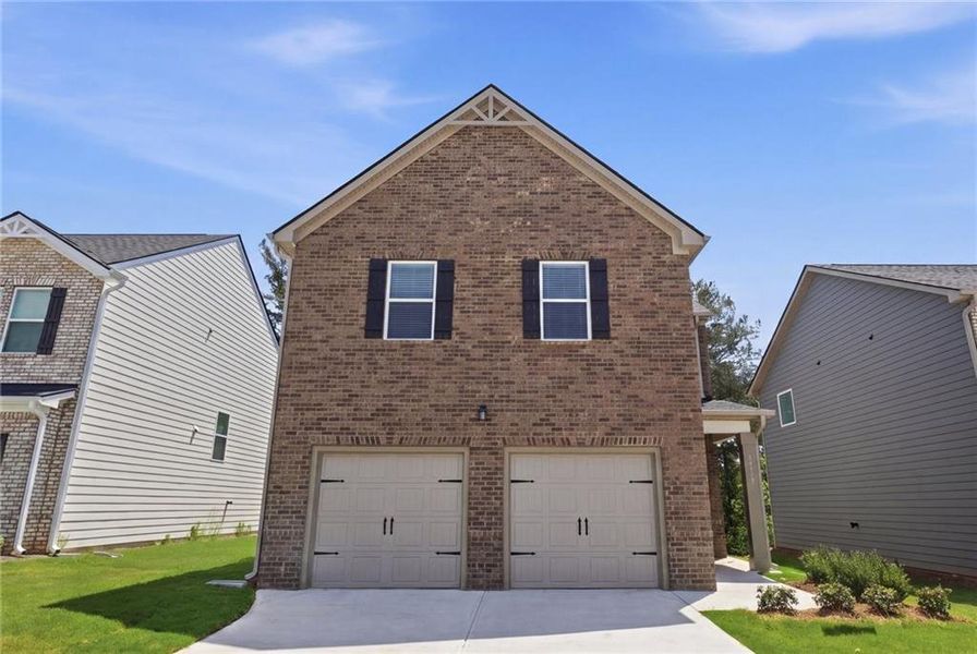 Front exterior of a new home in Creekbend Overlook, South Fulton, GA, highlighting curb appeal (Image 1). Front exterior of a new home in Creekbend Overlook, South Fulton, GA, highlighting curb appeal (Image 1).