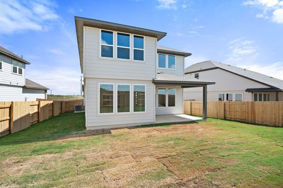 Exterior details and patio area of a home in Terrace Collection At Turner's Crossing, Buda (Image 20).