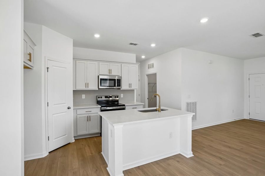 Kitchen featuring the AW Collection® Serene - Clean lines and earthy textures define the space.