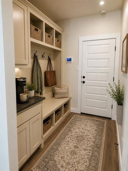 Virtually staged mudroom bench area Virtually staged mudroom bench area