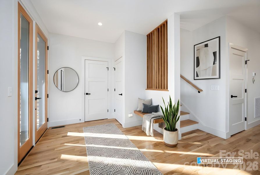 Inviting Entry with Sitting Bench and Coat Closet (Virtually Staged)
