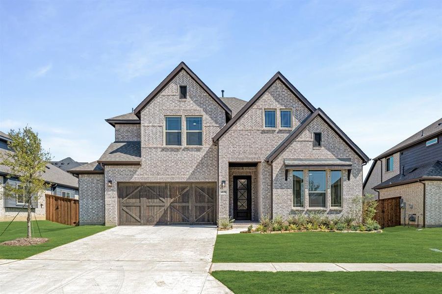 Front exterior of a new home in Windsong Ranch Classic 61, Prosper, TX, highlighting curb appeal (Image 19). Front exterior of a new home in Windsong Ranch Classic 61, Prosper, TX, highlighting curb appeal (Image 19).