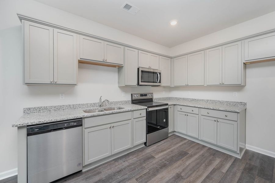 Representative furnished interior of a home built from the SULLIVAN by D.R. Horton in Summerville, Darlington (Image 5).