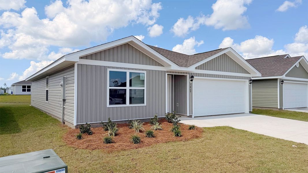 Front exterior of a new home in Liberty, Panama City, FL, highlighting curb appeal (Image 2). Front exterior of a new home in Liberty, Panama City, FL, highlighting curb appeal (Image 2).