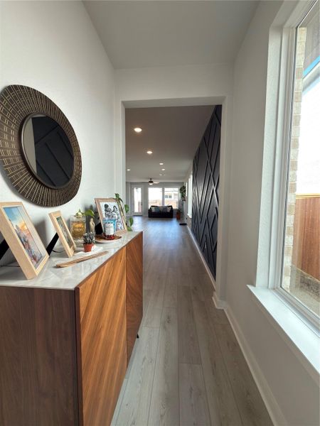 Entryway featuring light wood-finish flooring, white walls, and recessed lighting