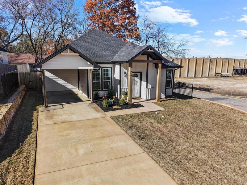 Front exterior of a new home in , Denison, TX, highlighting curb appeal (Image 19). Front exterior of a new home in , Denison, TX, highlighting curb appeal (Image 19).