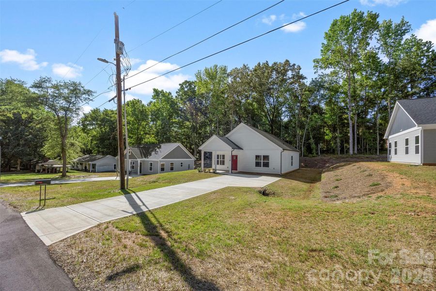 Front exterior of a new home in , Kings Mountain, NC, highlighting curb appeal (Image 19).