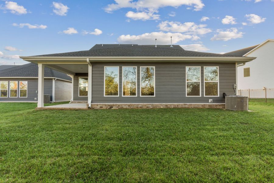 Exterior details and patio area of a home in Nexus – Village Collection, Gallatin (Image 24).