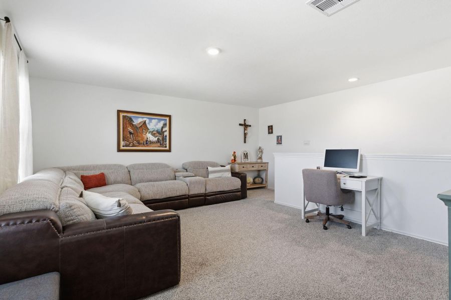 Upstairs game room offering extra space for relaxation or entertainment. Upstairs game room offering extra space for relaxation or entertainment.