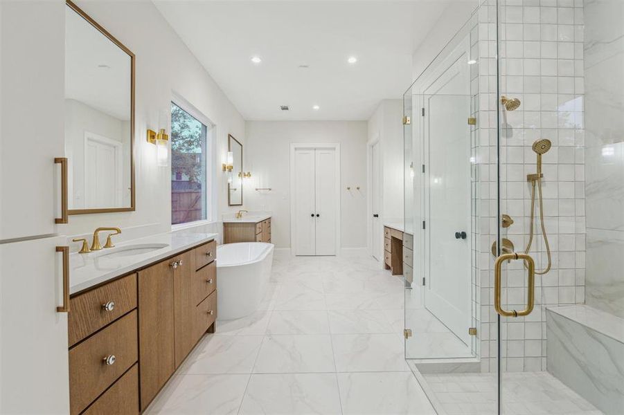 Primary bath features walk-in shower, soaking tub and luxury finish quality