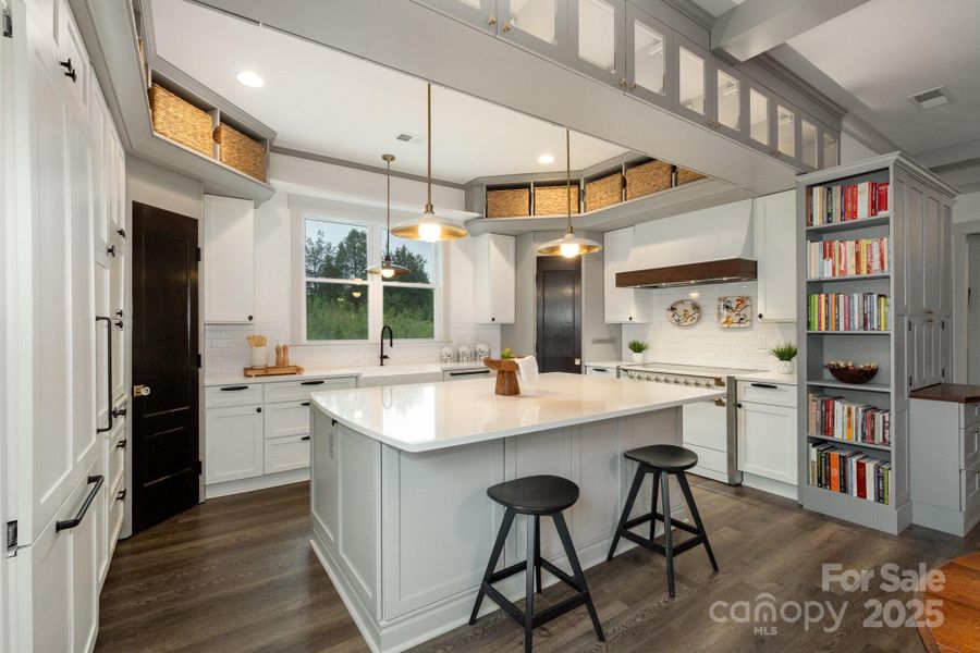 Gourmet appliances are perfect for the chef! Paneled Miele refrigerator and dishwasher and Aga range. Gourmet appliances are perfect for the chef! Paneled Miele refrigerator and dishwasher and Aga range.