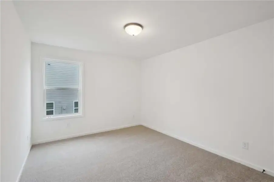 Spacious, unfurnished interior of a new home in Eastlyn Crossing, Flowery Branch (Image 18).