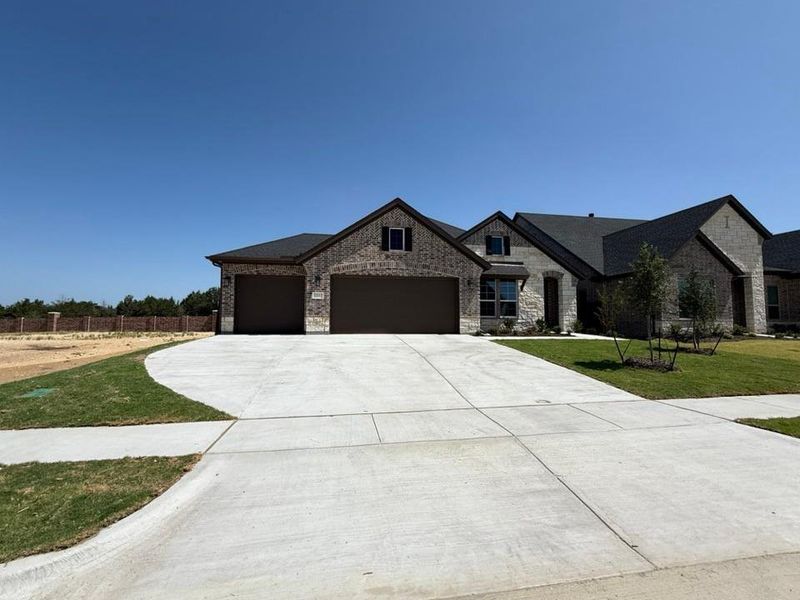 Front exterior of a new home in Waterford Park, Weatherford, TX, highlighting curb appeal (Image 15). Front exterior of a new home in Waterford Park, Weatherford, TX, highlighting curb appeal (Image 15).