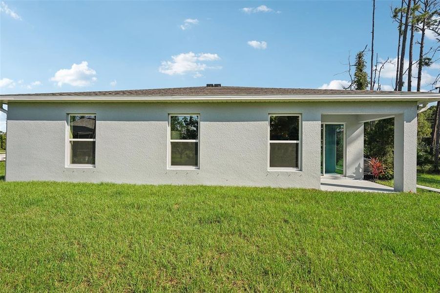 Exterior details and patio area of a home in North Port Classic, North Port (Image 32).
