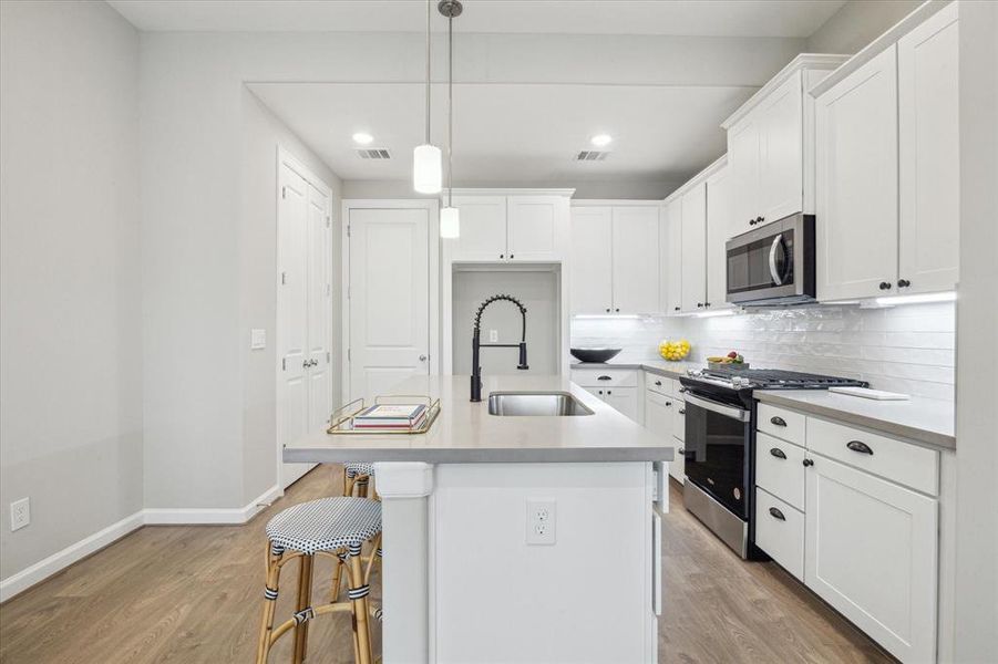 A view of the kitchen as seen fromthe dining area.