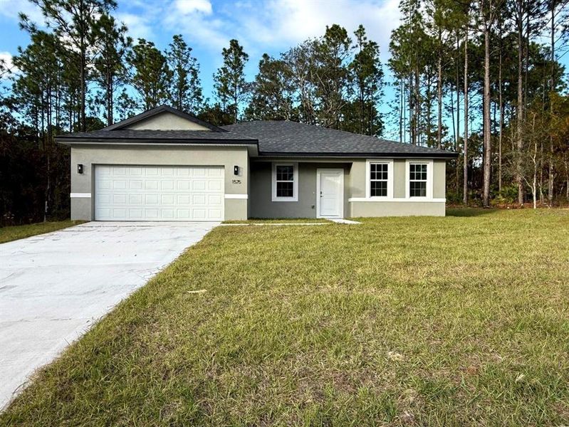 Front exterior of a new home in , Citrus Springs, FL, highlighting curb appeal (Image 27).
