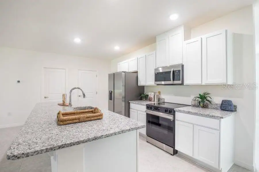 Furnished interior view inside a new home in Coastal Communities, Edgewater (Image 10).