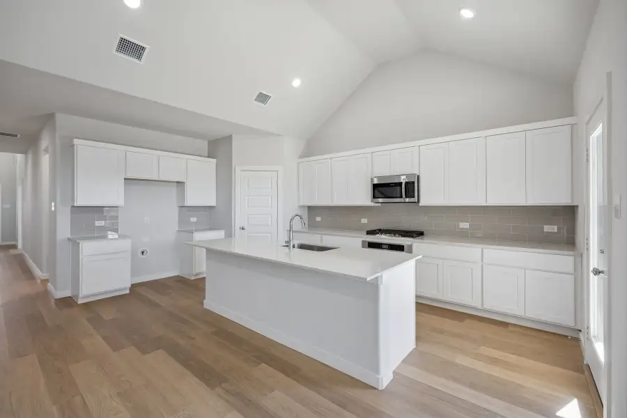 Kitchen in the Wimbledon home plan by Trophy Signature Homes – REPRESENTATIVE PHOTO Kitchen in the Wimbledon home plan by Trophy Signature Homes – REPRESENTATIVE PHOTO