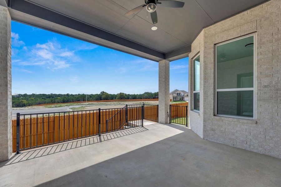 View of patio / terrace featuring a ceiling fan and a water view View of patio / terrace featuring a ceiling fan and a water view