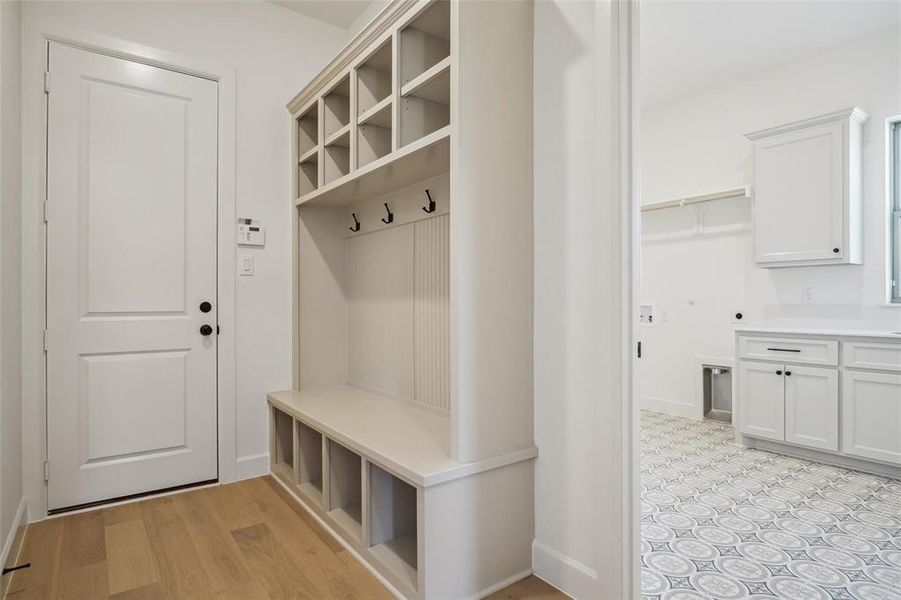 Mudroom with light wood-type flooring