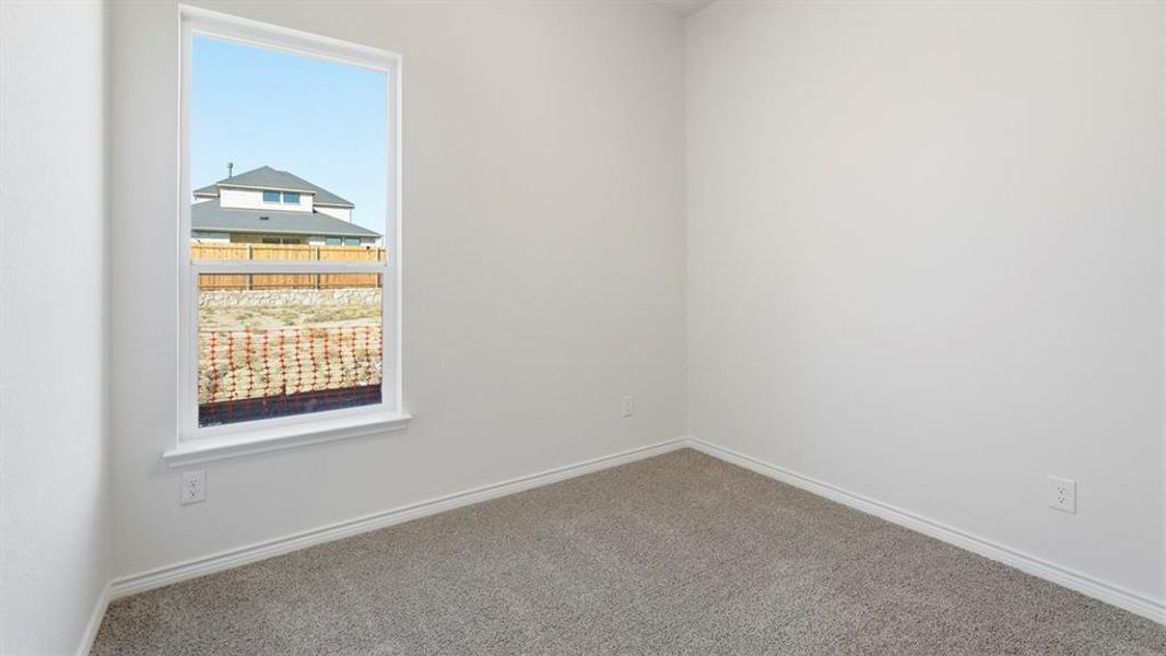 Empty room with baseboards and carpet Empty room with baseboards and carpet
