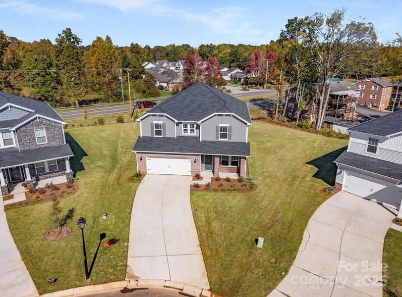 Front exterior of a new home in Nelson's Creek, Mocksville, NC, highlighting curb appeal (Image 2). Front exterior of a new home in Nelson's Creek, Mocksville, NC, highlighting curb appeal (Image 2).