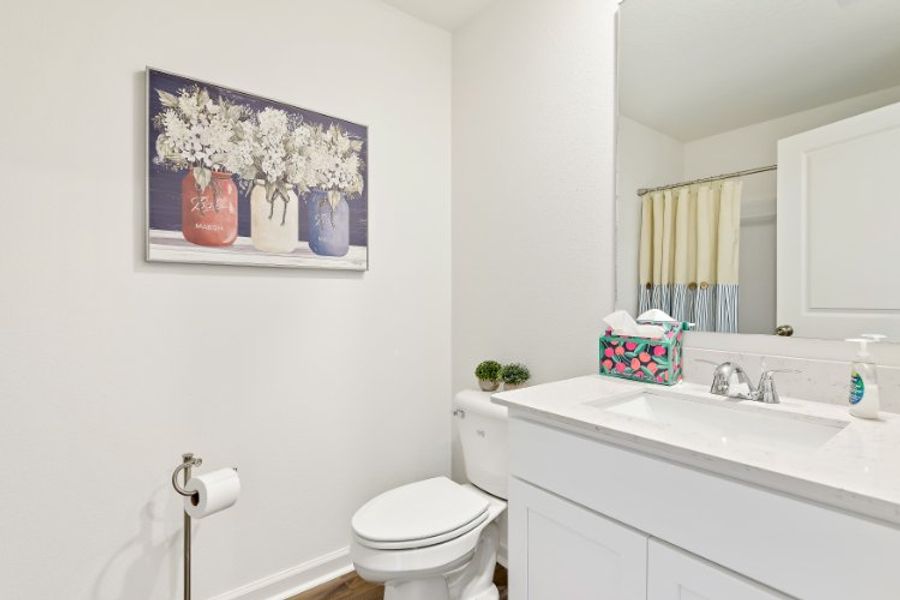 A bathroom with a toilet and sink.