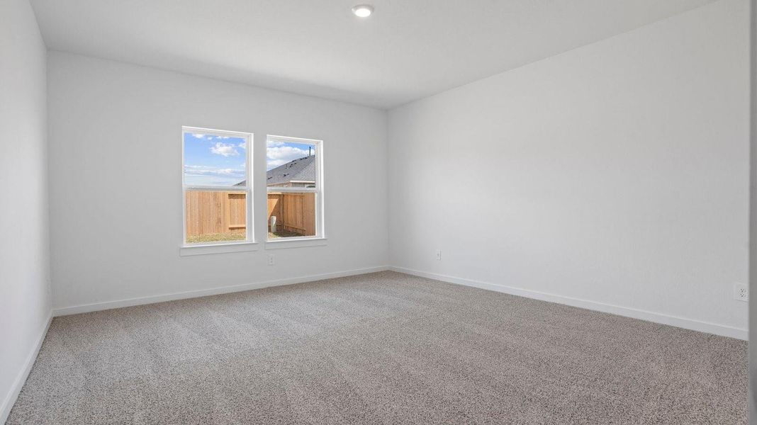 Spacious, unfurnished interior of a new home in Caldwell Crossing, Iowa Colony (Image 13).