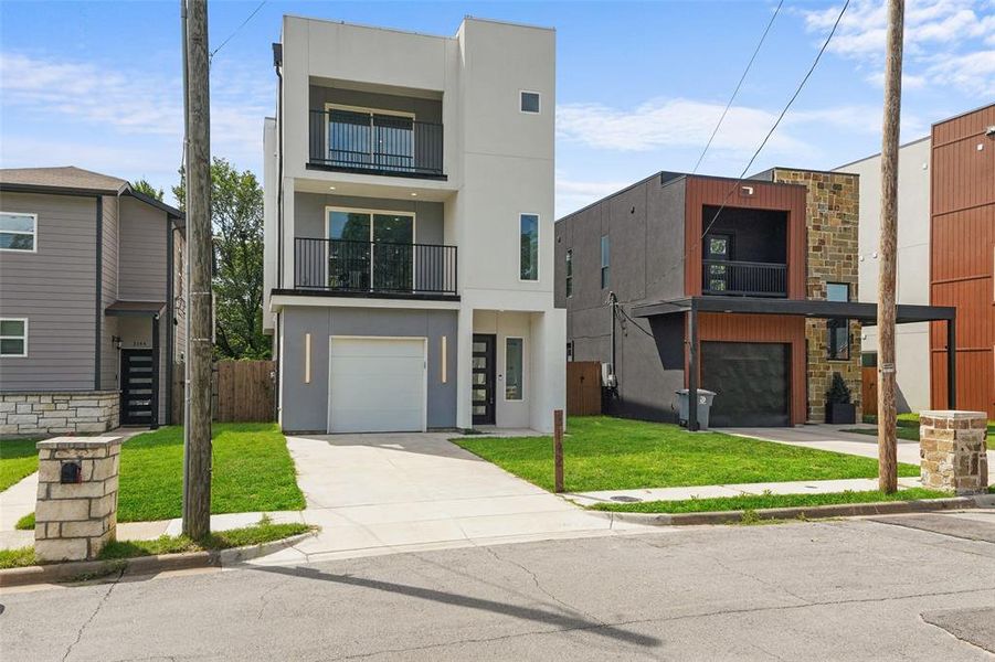 Front exterior of a new home in , Dallas, TX, highlighting curb appeal (Image 24).