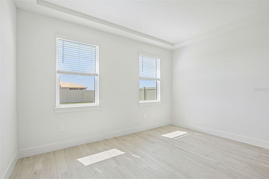 Spacious, unfurnished interior of a new home in Magnolia Bay - Reserve Series, Nokomis (Image 19).