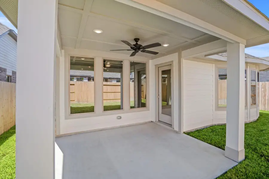 Exterior details and patio area of a home in Grand Central Park, Conroe (Image 3).