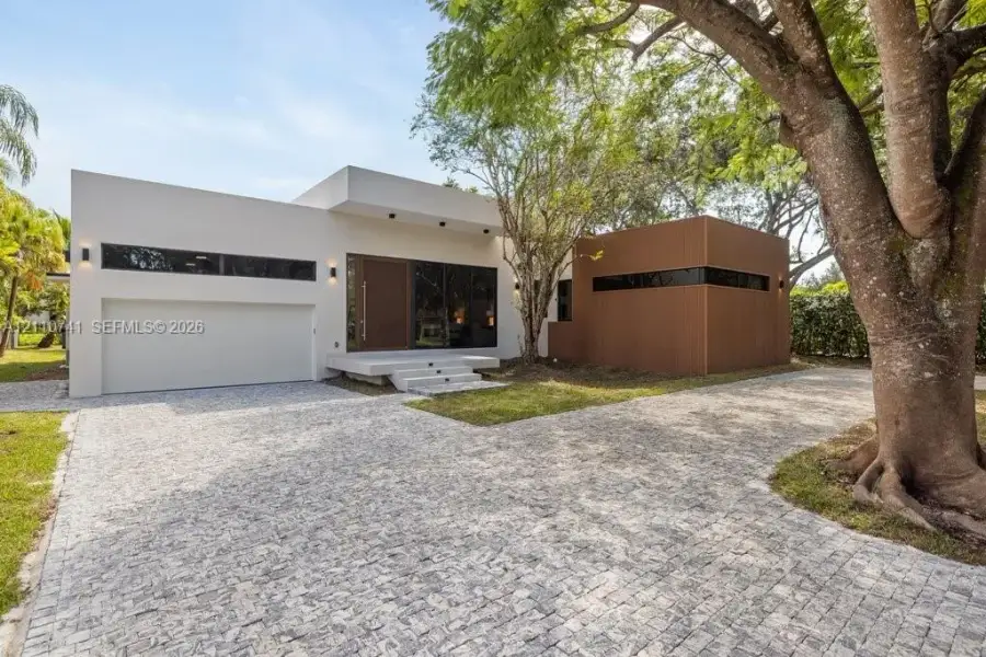 Front exterior of a new home in , Pinecrest, FL, highlighting curb appeal (Image 1). Front exterior of a new home in , Pinecrest, FL, highlighting curb appeal (Image 1).