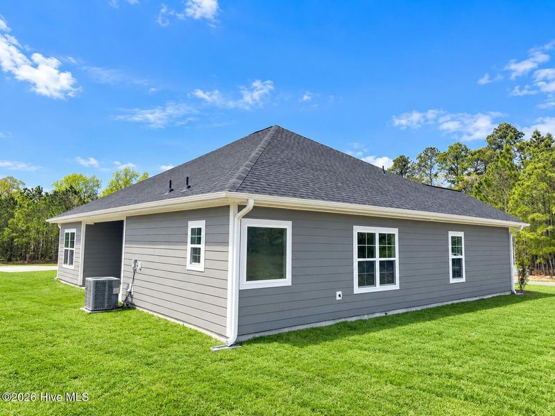 Exterior details and patio area of a home in East Lake, Leland (Image 3).