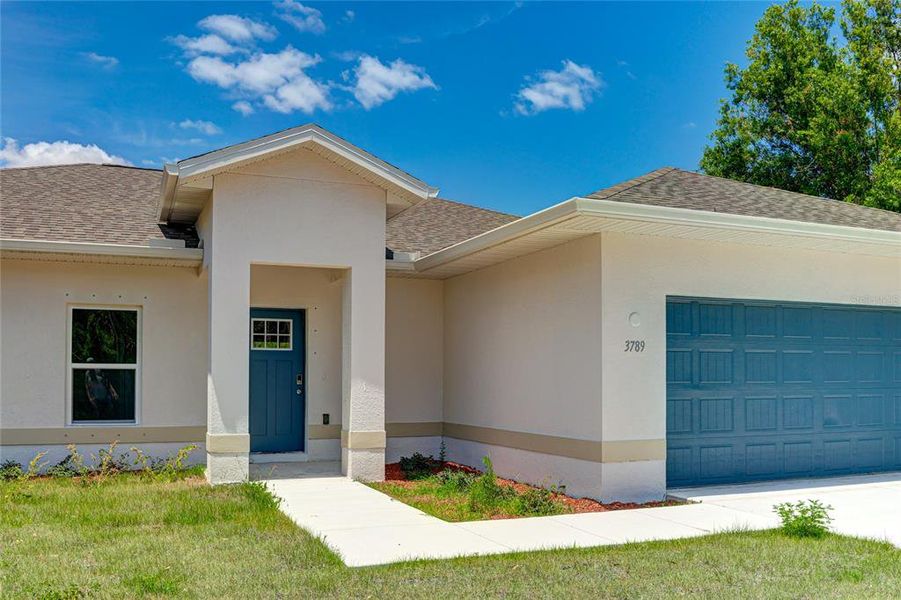 Front exterior of a new home in , North Port, FL, highlighting curb appeal (Image 26).