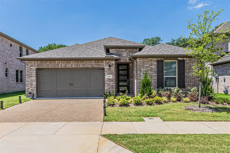 Front exterior of a new home in Stoneridge, Melissa, TX, highlighting curb appeal (Image 1). Front exterior of a new home in Stoneridge, Melissa, TX, highlighting curb appeal (Image 1).