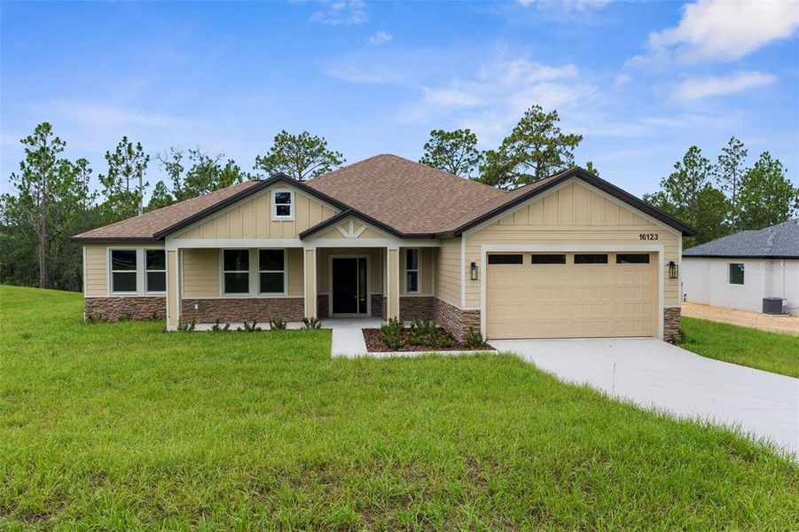 Front exterior of a new home in , Weeki Wachee, FL, highlighting curb appeal (Image 18).
