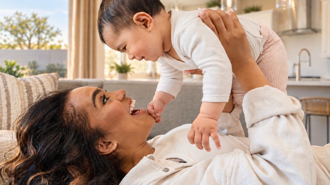DRB Homes Mother Laughing with Infant DRB Homes Mother Laughing with Infant
