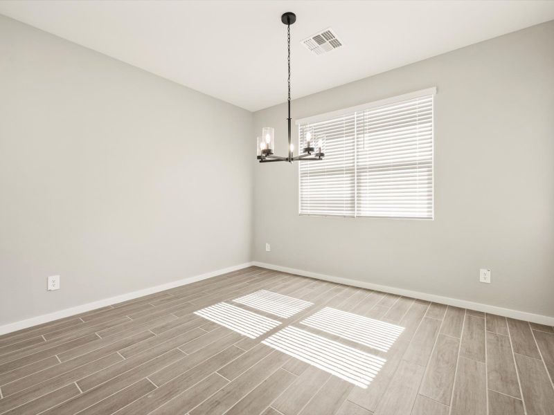 Spacious, unfurnished interior of a new home in Blossom Rock Reserve Series, Apache Junction (Image 9).