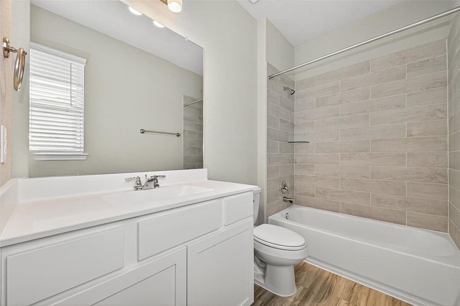 Furnished interior view inside a new home in Sunterra, Katy (Image 14).