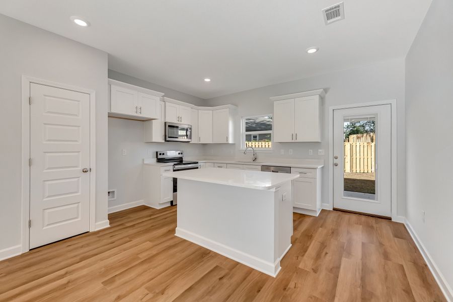 Furnished interior view inside a new home in Live Oak Cottages, Freeport (Image 5).