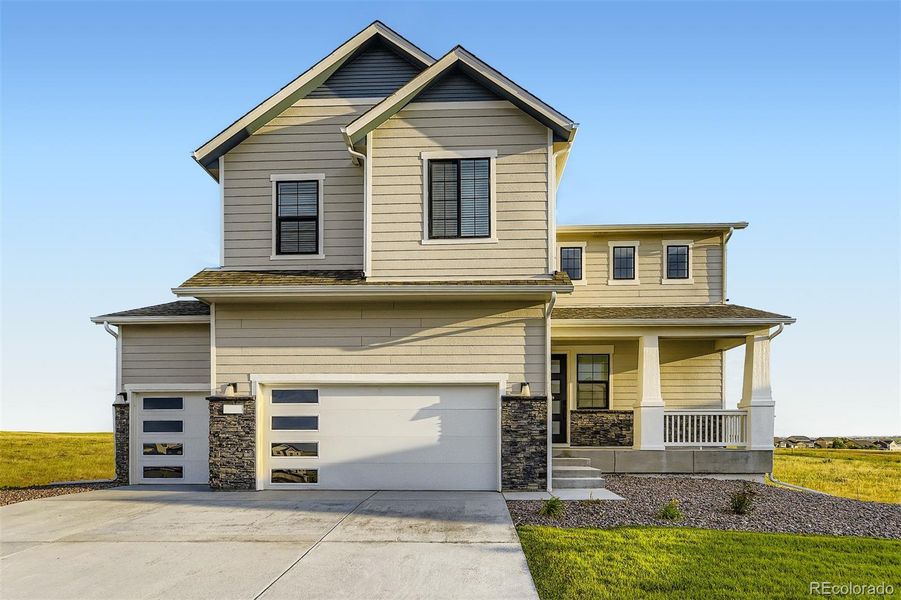 Front exterior of a new home in , Elizabeth, CO, highlighting curb appeal (Image 1).
