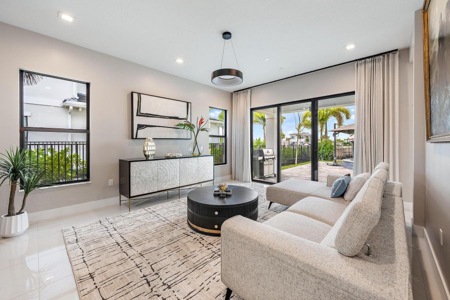 Spacious sitting room with easy access to the outdoor patio and pool.