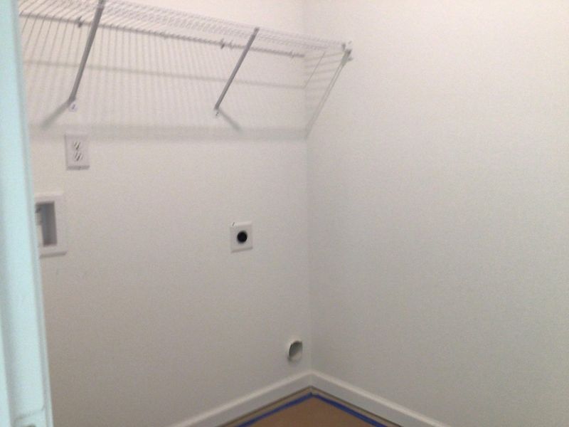 Laundry Room featuring the AW Collection® Coastal - Bright space with wire shelving for ease.