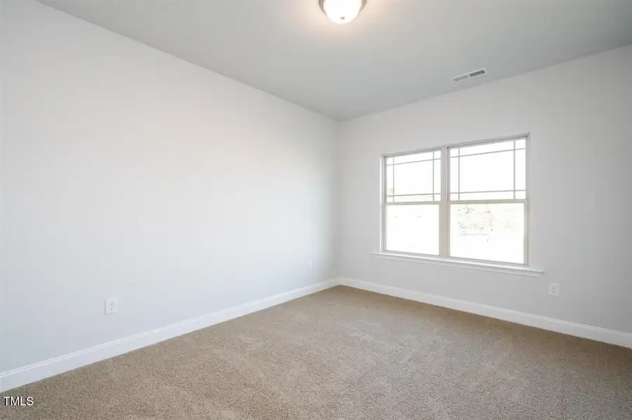 Representative unfurnished interior of a home built from the 2316 by Adams Homes in Hidden Pines, Cameron (Image 28).
