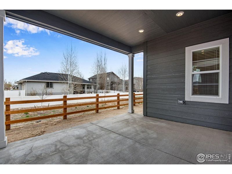 Exterior details and patio area of a home in Westside Crossing, Berthoud (Image 24).