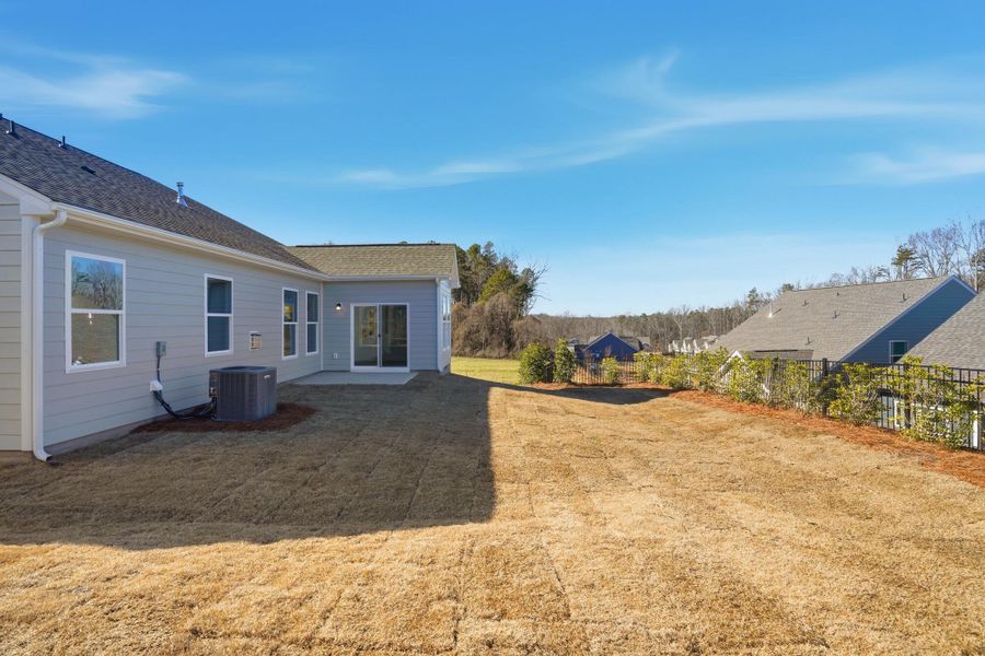 Exterior details and patio area of a home in Villas at Prestwick, Mooresville (Image 31).
