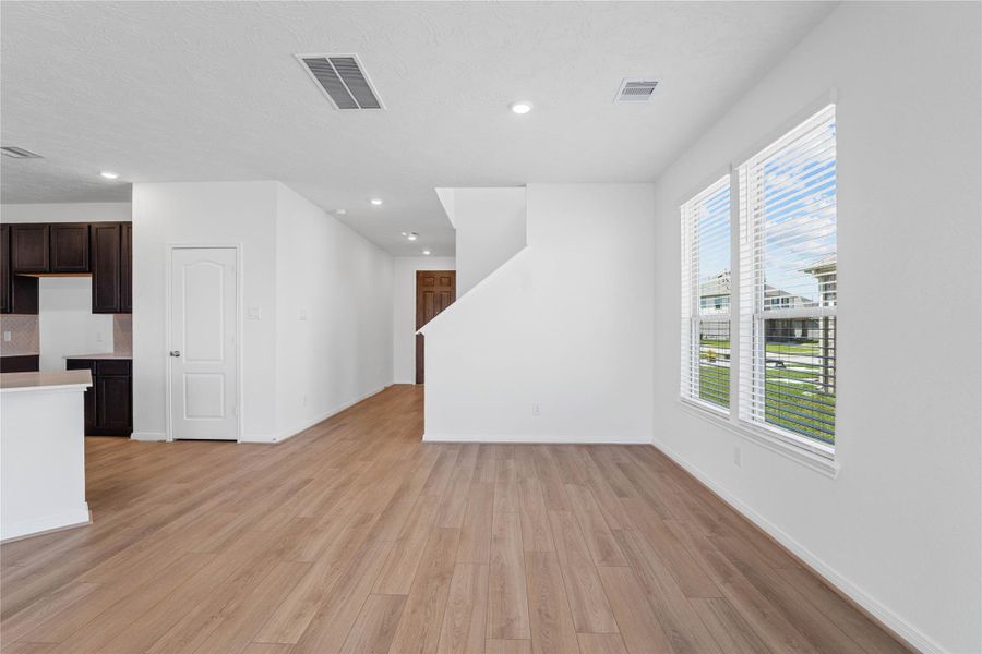 Create lasting memories with family and friends in this inviting dining room! It showcases high ceilings, recessed lighting, large windows with blinds, custom neutral paint, and stunning vinyl plank flooring. Create lasting memories with family and friends in this inviting dining room! It showcases high ceilings, recessed lighting, large windows with blinds, custom neutral paint, and stunning vinyl plank flooring.