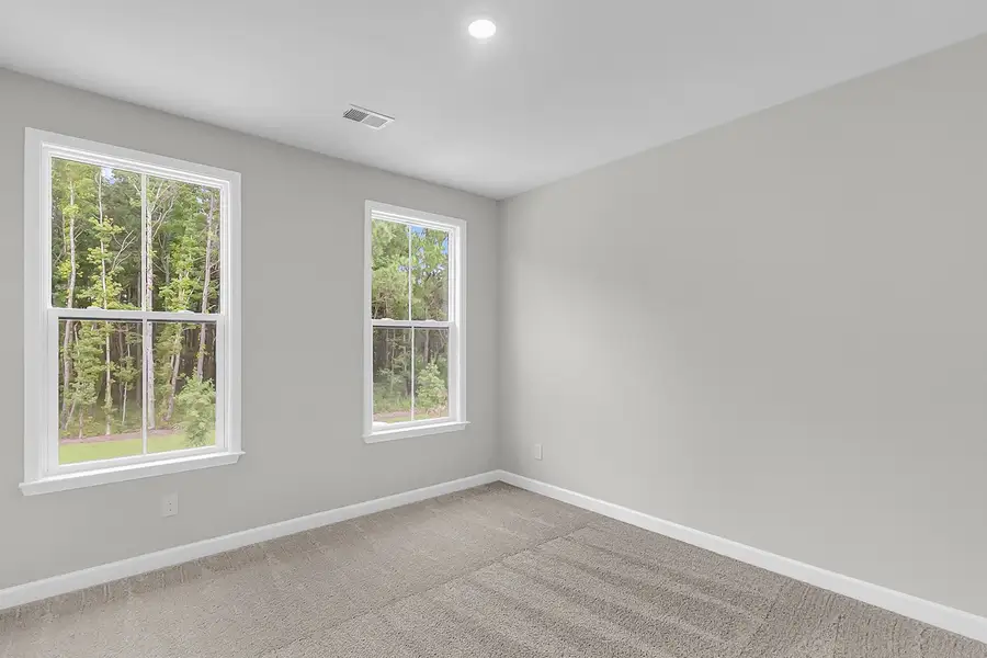 Spacious, unfurnished interior of a new home in Pineland Preserve, Summerville (Image 32).
