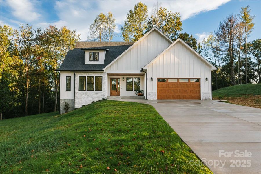 Front exterior of a new home in , Candler, NC, highlighting curb appeal (Image 1). Front exterior of a new home in , Candler, NC, highlighting curb appeal (Image 1).